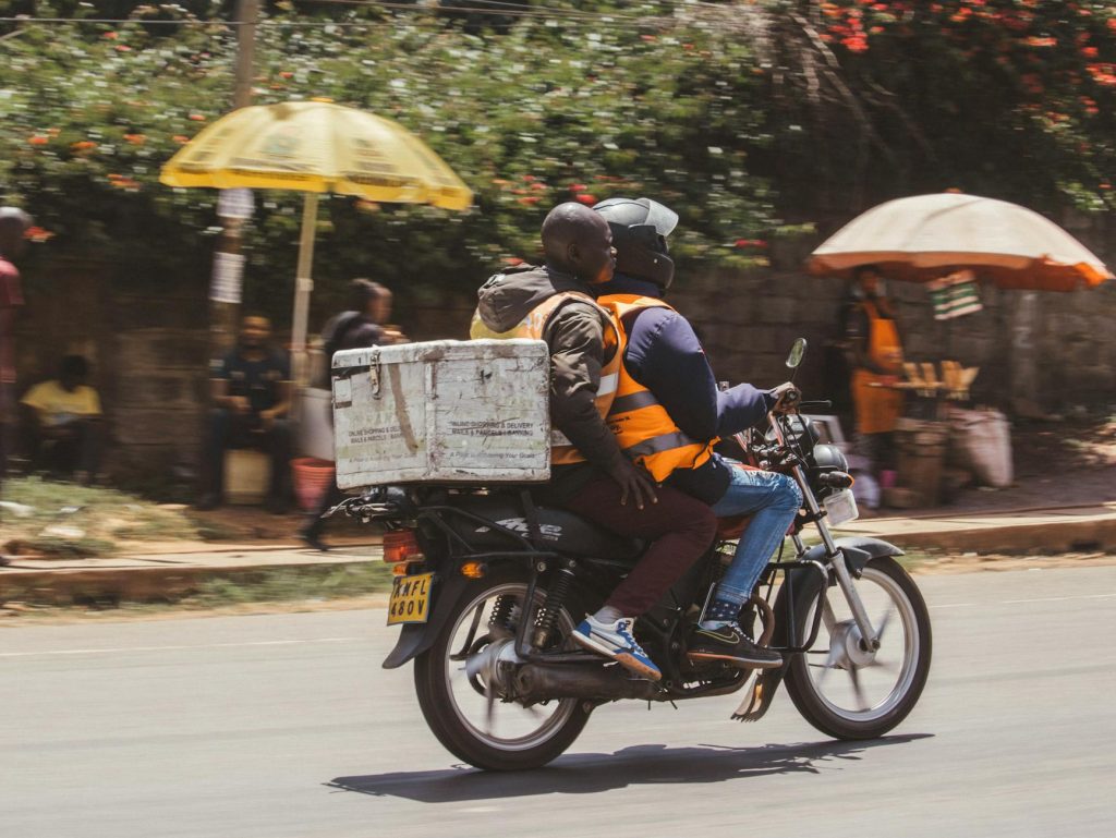 A moving truck with boxes parked on a residential street in Nairobi.
