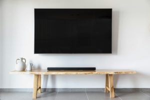 Professional TV bracket installation by Good Life Movers Kenya, mounting a flat screen securely on a wall.