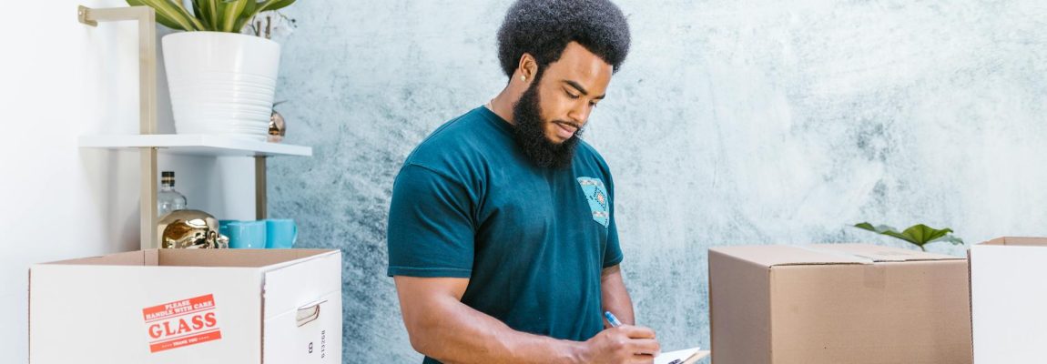 Professional office movers in Kenya relocating furniture and boxes from a commercial building.